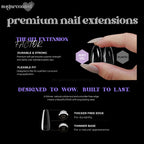 a woman's hand holding a black and white nail